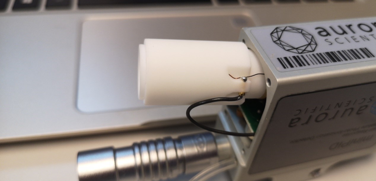 Figure 1. Lamp housing revealing intact black wire connected to antenna and lamp lighting circuit.